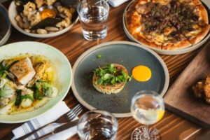 Delicious Canmore restaurant food: pizza, fish, and appetizers