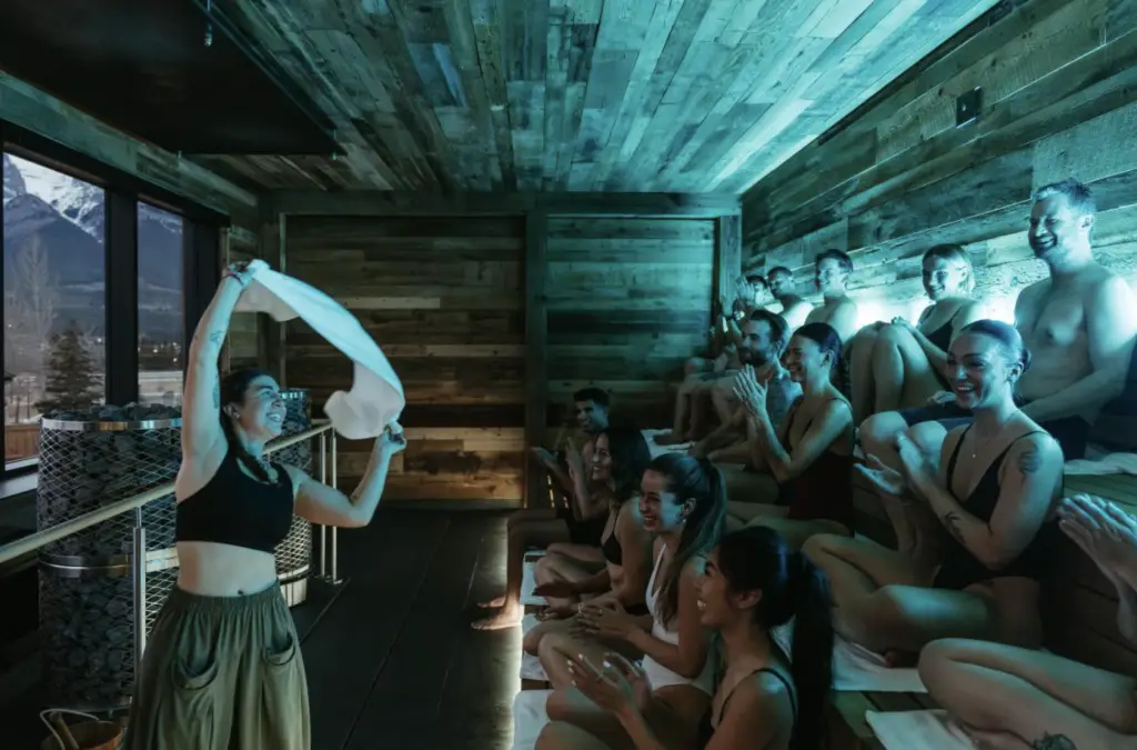 Everwild Nordic Spa in Canmore: Woman leads sauna session for guests